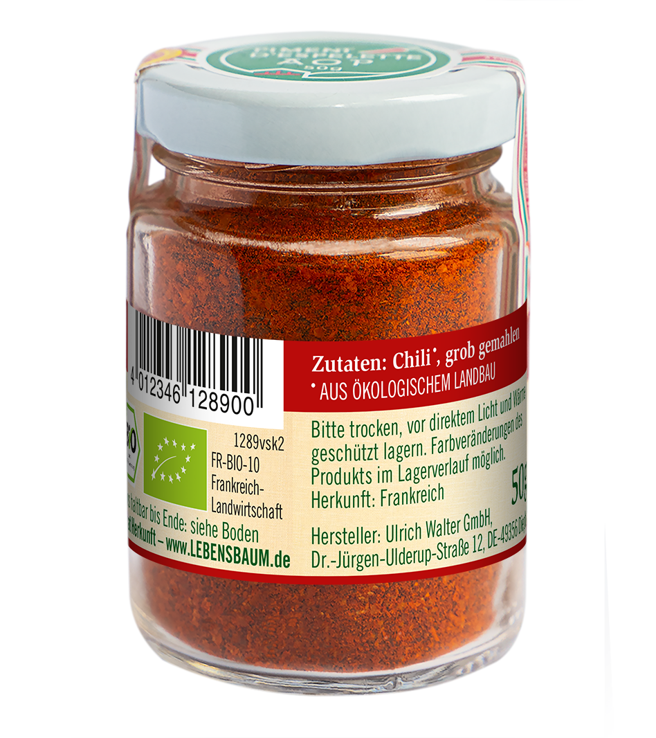 Piment d'Espelette, feingemahlenes rotes Gewürzpulver im Glasgefäß mit weißem Deckel, Bio-Zertifikat und rotem Etikett vom Hersteller Lebensbaum